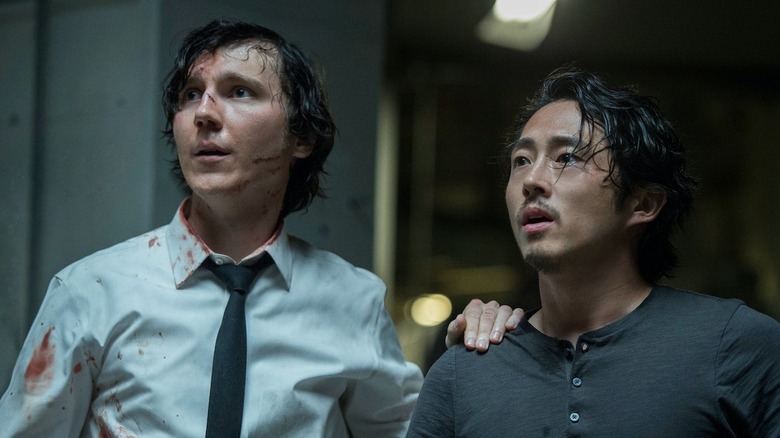 Paul Dano and Steven Yeun in Okja