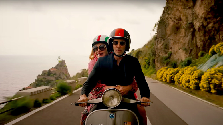 Jennifer Coolidge and Jon Gries take a vespa ride in season 2 of The White Lotus