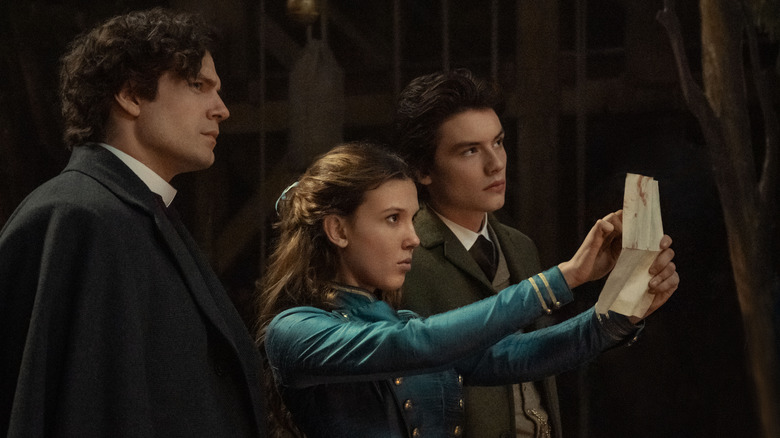 Henry Cavill, Millie Bobby Brown, and Louis Partridge in Enola Holmes 2