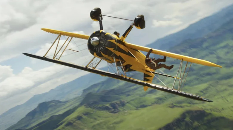 Ethan Hunt hangs from an upside-down plane in Mission: Impossible - The Final Reckoning