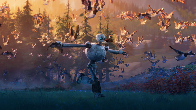 Roz running amongst flying geese in The Wild Robot