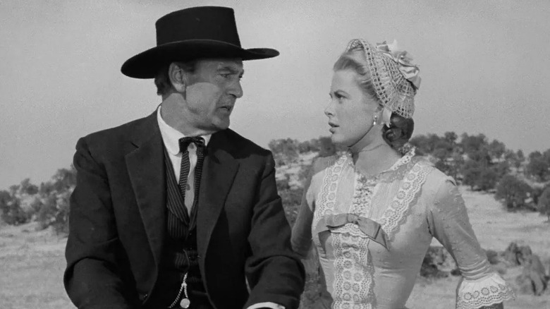 Gary Cooper's Kane in a black cowboy hat, speaking to Grace Kelly's Amy in High Noon