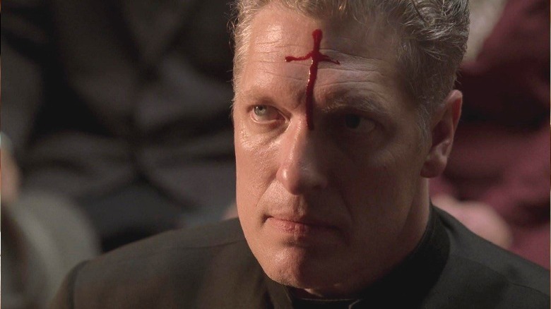 Clancy Brown in Carnivale with blood cross on forehead