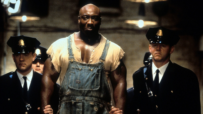 Michael Clarke Duncan escorted by guards