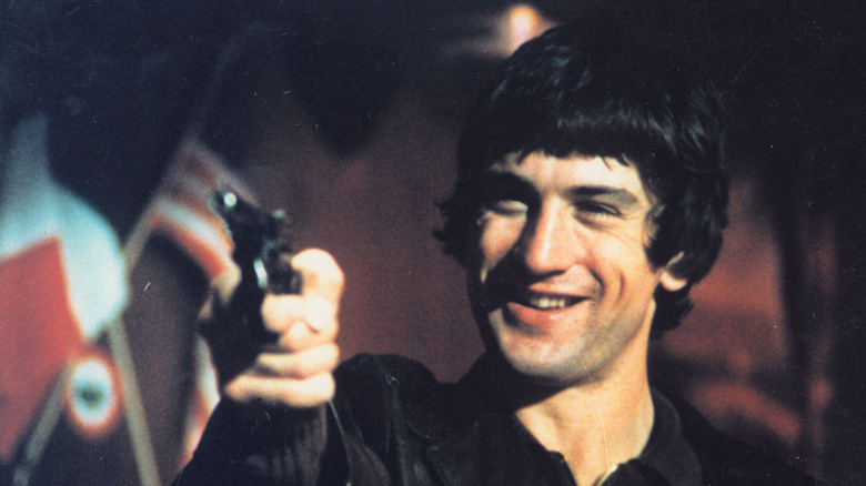 Robert De Niro points gun