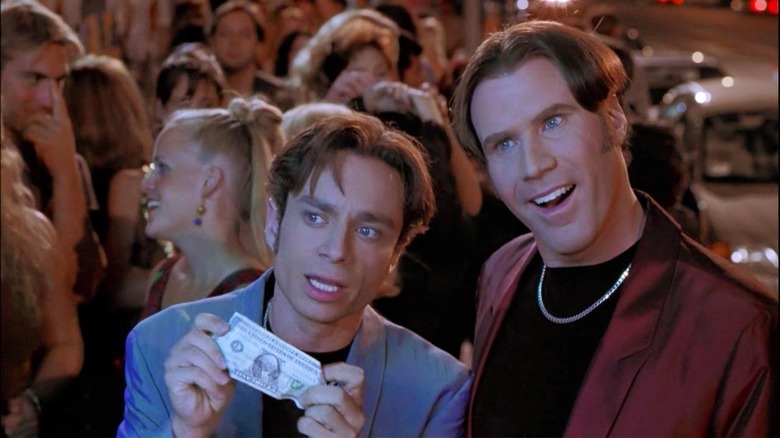 Chris Kattan holds dollar while Will Ferrell smiles