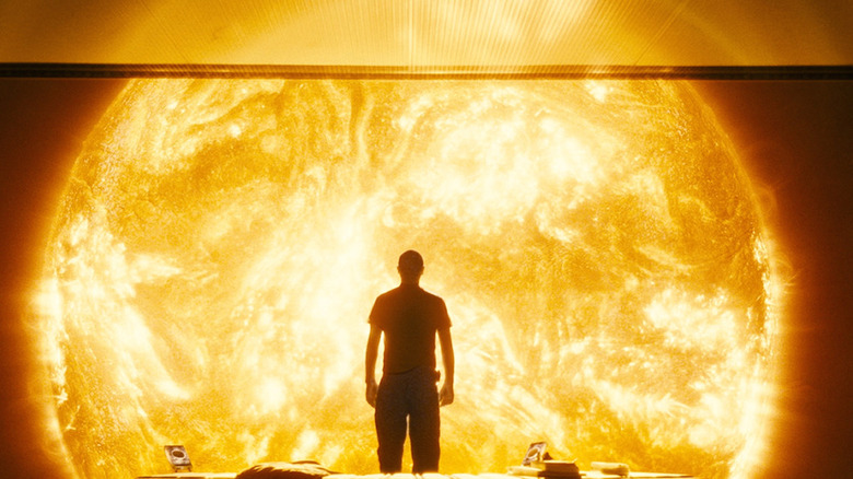 Man in front of dying sun