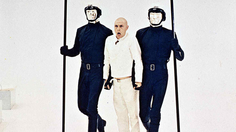 THX-1138 transported by guards