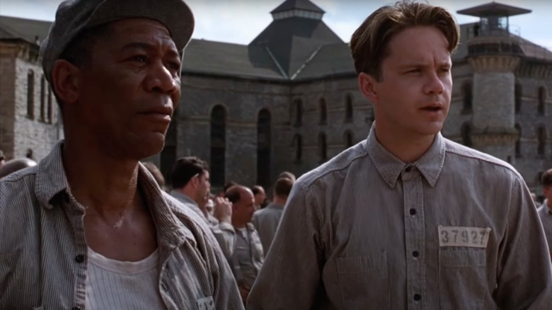 Morgan Freeman as Red and Tim Robbins as Andy Dufresne talk in The Shawshank Redemption