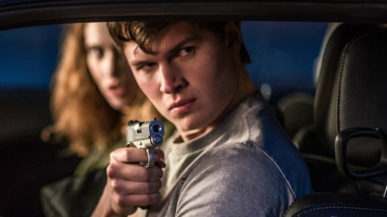 Baby Driver pointing a gun