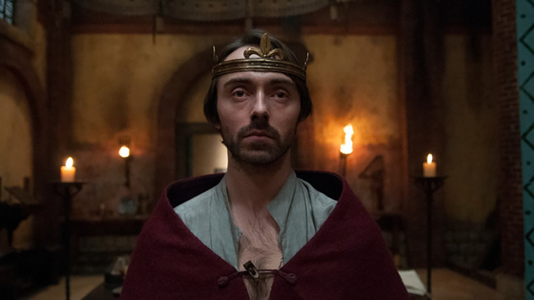 david dawson looking ahead in a king's costume in the show the last kingdom