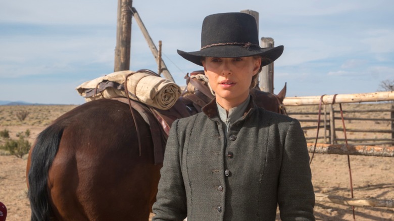 Jane standing aside her horse in Jane Got a Gun