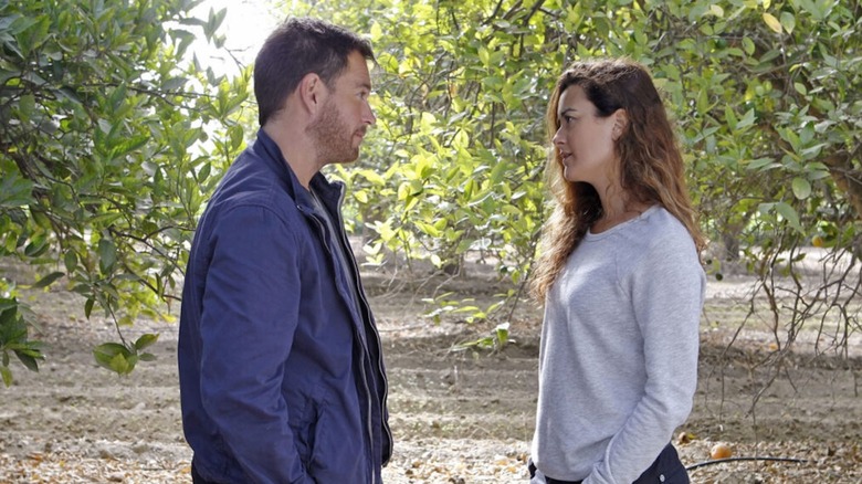 Michael Weatherly as Tony DiNozzo and Cote de Pablo as Ziva David meet in a grove in NCIS