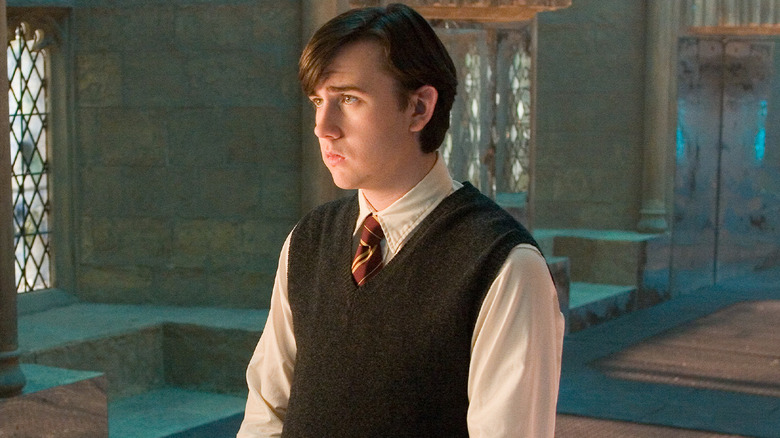 Neville in the Room of Requirement staring ahead in Harry Potter and the Order of the Phoenix