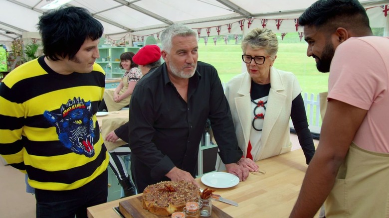 Great British Baking Show Hosts Judging Cake