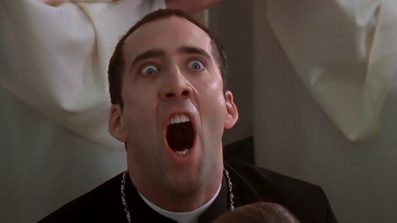 Nicolas Cage singing and looking crazy in Face/Off