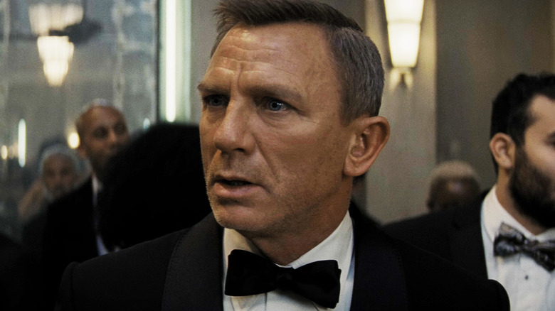 Daniel Craig's James Bond wears a tuxedo at a party in No Time to Die