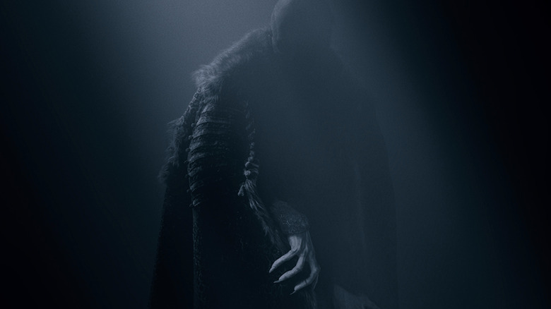 Count Orlok in the shadows on poster for 2024's Nosferatu