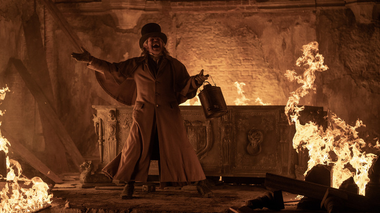 Willem Dafoe as Professor Albin Eberhart Von Franz shouting in delight when burning Orlok's grave in Nosferatu