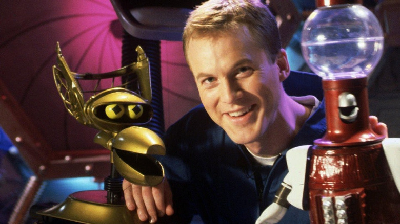 Host Mike Nelson with his trusty bots in Mystery Science Theater 3000