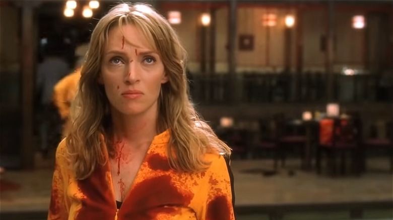 Uma Thurman yellow jumpsuit covered in blood Kill Bill