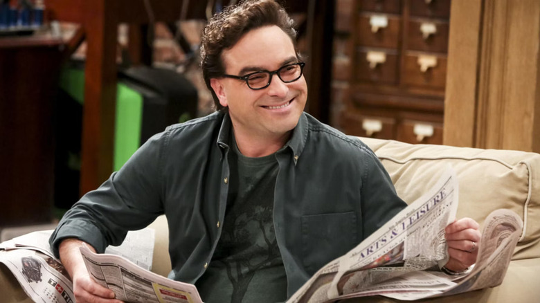 Leonard smiling reading paper Big Bang Theory