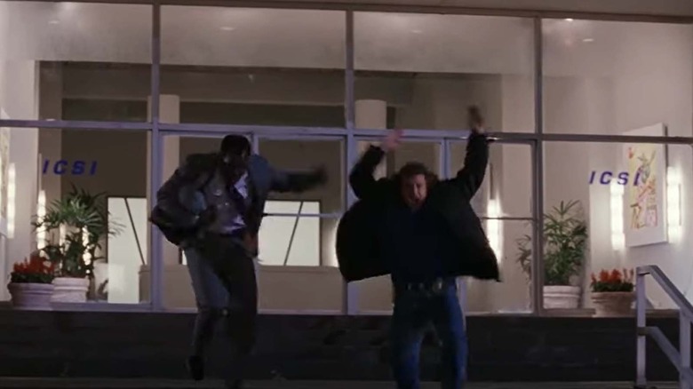 Mel Gibson and Danny Glover flee the building in Lethal Weapon 3.