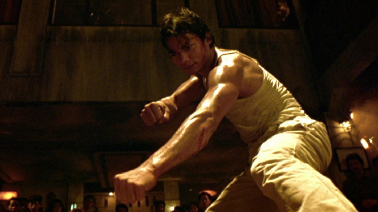 Tony Jaa flexes his fists in "Ong Bak: Muay Thai Warrior" (2003)