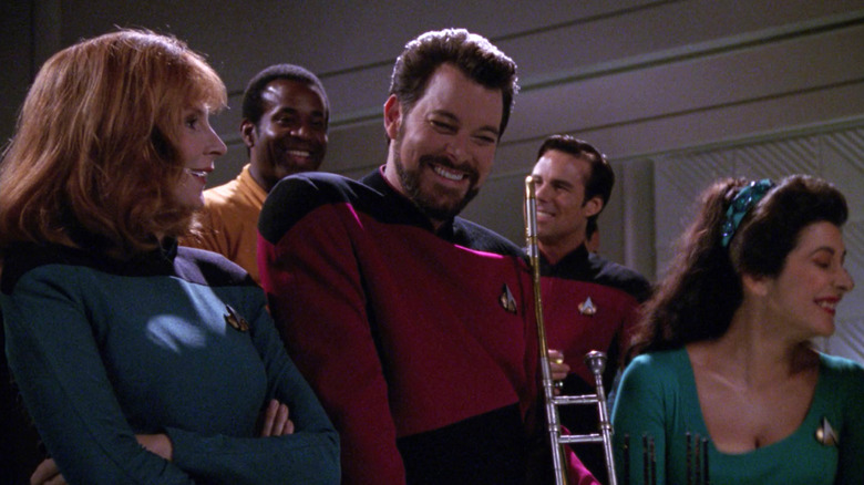 Gates McFadden as Dr. Beverly Crusher, Jonathan Frakes as Will Riker, and Marina Sirtis as Deanna Troi on Star Trek: The Next Generation