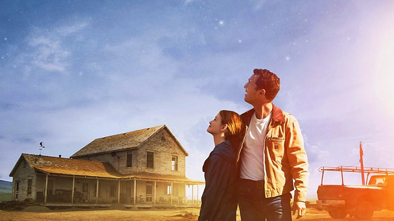 Poster for Interstellar with Cooper and Murphy looking up at the sky