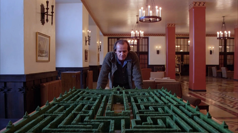 Jack Torrance looking at the hedge maze model in The Shining