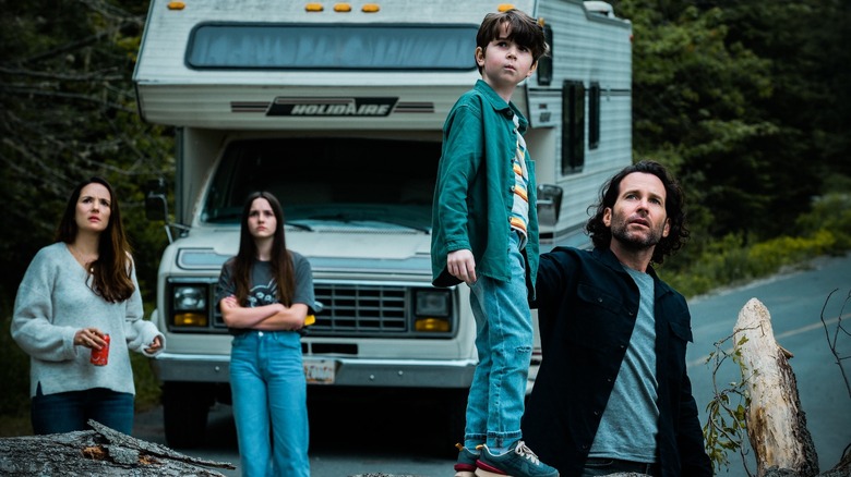 Matthews family in front of RV looking up From