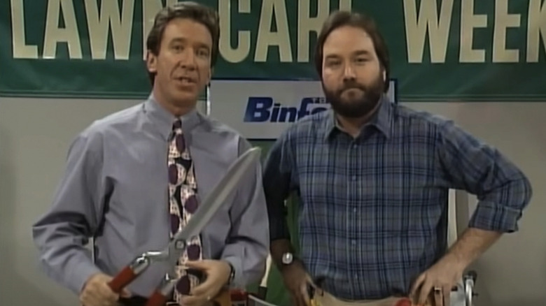 Tim Allen's Tim Taylor and Richard Karn's Al Boreland looking at the camera in Home Improvement