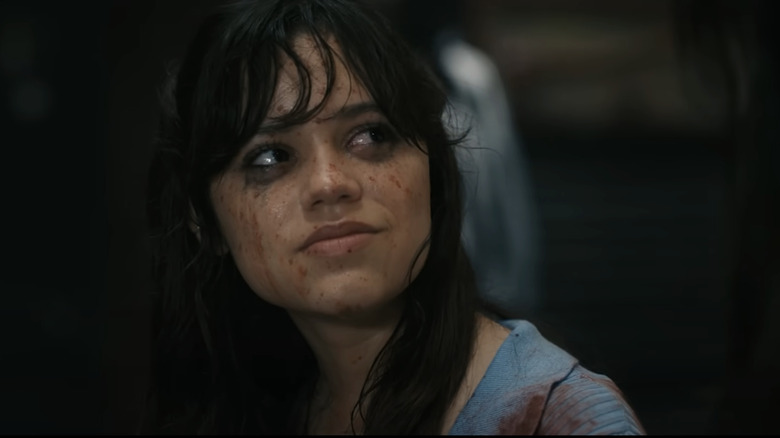 Jenna Ortega's Tara Carpenter smiles while covered in blood in Scream 6