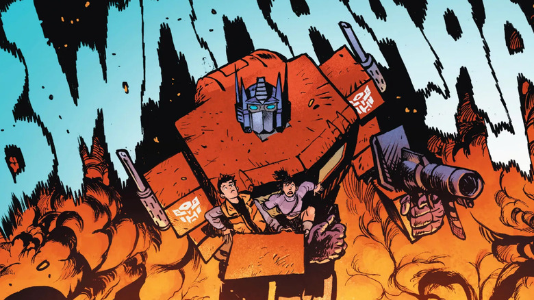 Transformers Optimus Prime carrying Spike and Carly