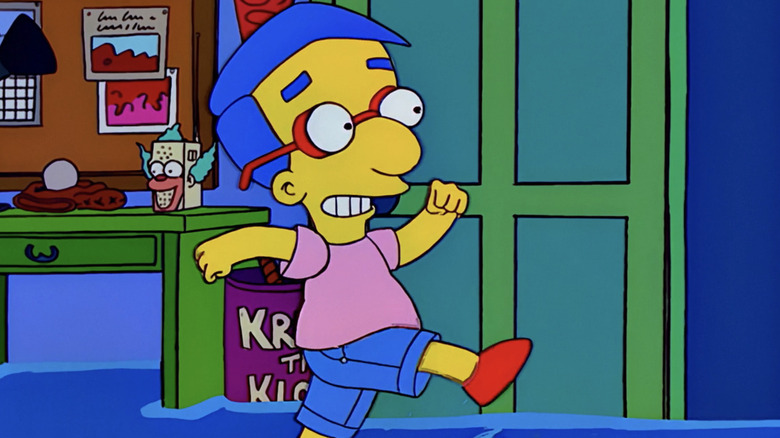 Milhouse happily skips along as his shorts mean his legs aren't getting wet in a flooded room in The Simpsons