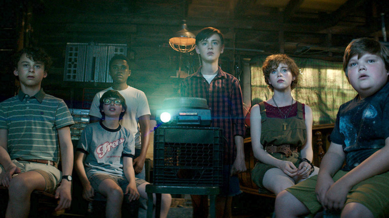 The Losers Club sits for a slide presentation in It