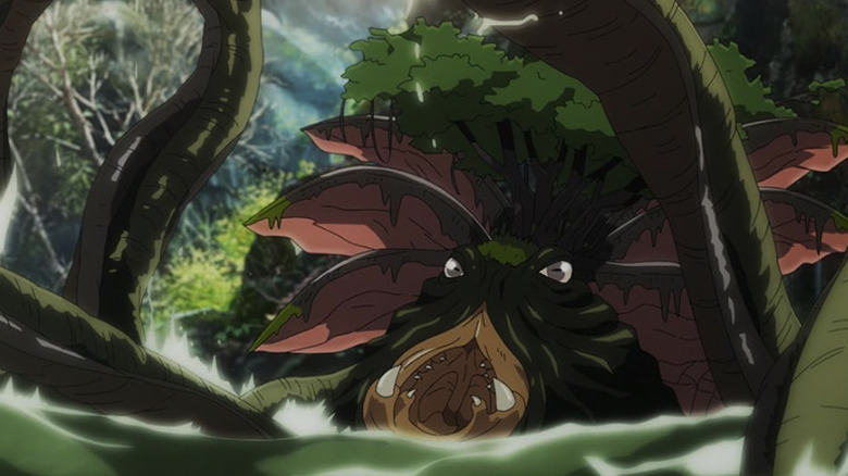 A swamp creature emerges from the water with an open mouth and a tree on its head in The War of the Rohirrim