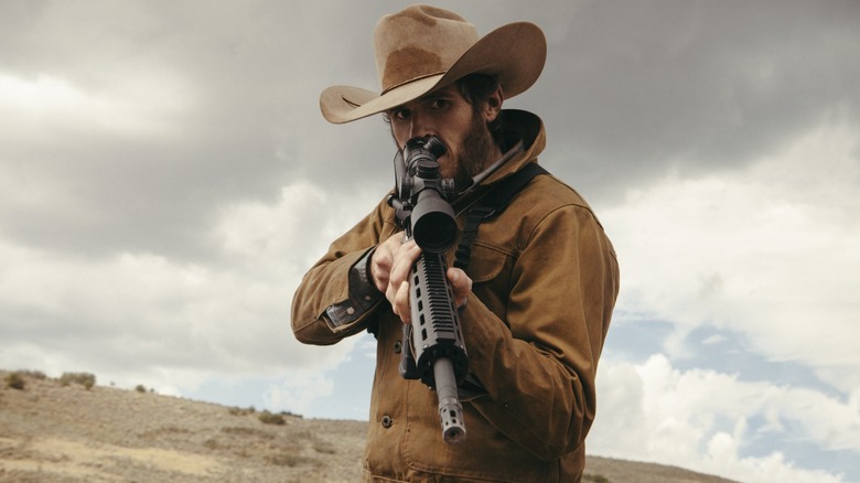 Lee Dutton holds a gun in Yellowstone