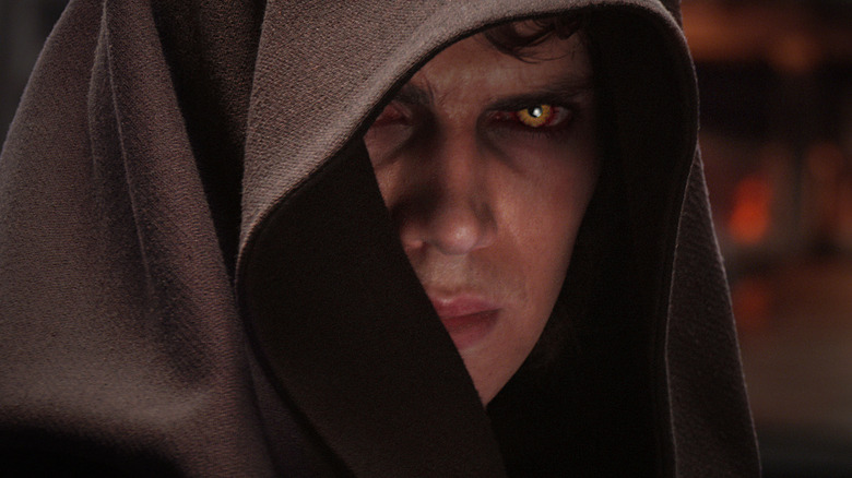 Anakin Skywalker with Sith eyes in a hood on Mustafar