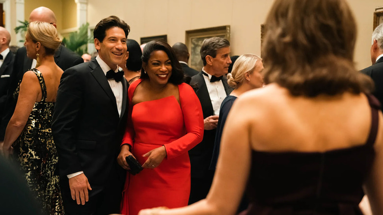 Aunjanue Ellis-Taylor's Isabel Wilkerson at party with husband played by Jon Bernthal in Origin