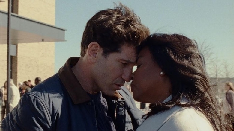 Aunjanue Ellis-Taylor's Isabel Wilkerson embraces husband played by Jon Bernthal in Origin