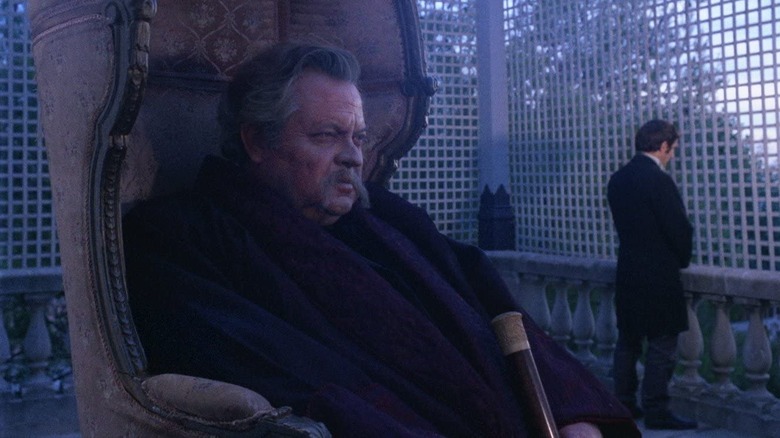 Orson Welles sits in giant chair