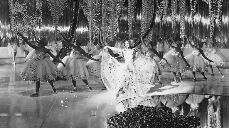 Irene (Eleanor Powell) performing surrounded by dancers in "Broadway Melody of 1936"