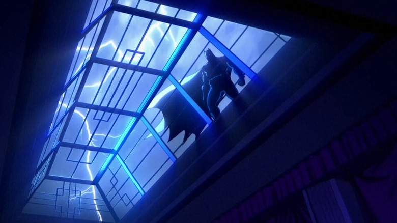 Batman stands by a skylight silhouetted by lightning in Creature Commandos