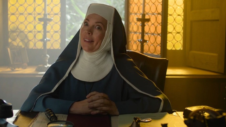 Reverend Mother sitting behind a desk in Paddington in Peru