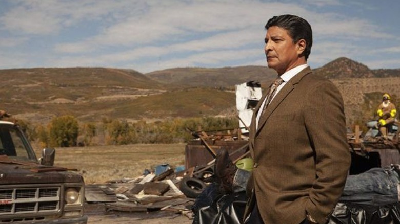 Man in suit rural background