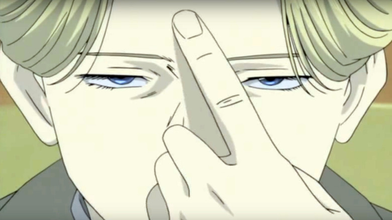 Johan Liebert pointing at his forehead