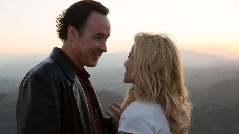 John Cusack as Brian Wilson smiles at Elizabeth Banks as Melinda Ledbetter in Love & Mercy