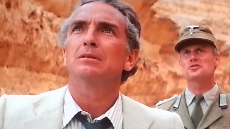 Belloq and Toht in a canyon in "Raiders of the Lost Ark"